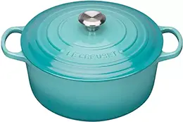 A large teal coloured Le Creuset Round Casserole Dish